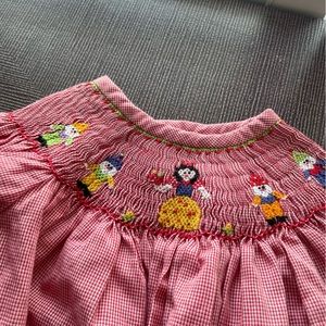 Smocked dress Snow White and the dwarves. Banbury cross New Orleans. 12 month